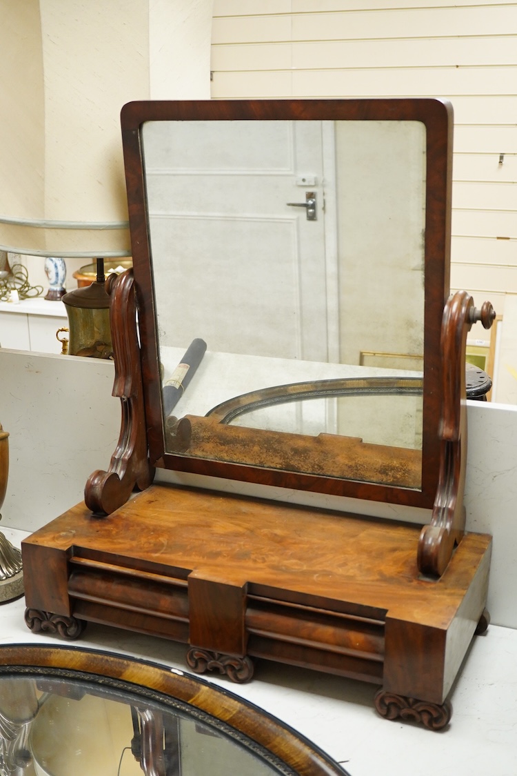 A mahogany toilet mirror and an oval wall mirror, 77cm wide